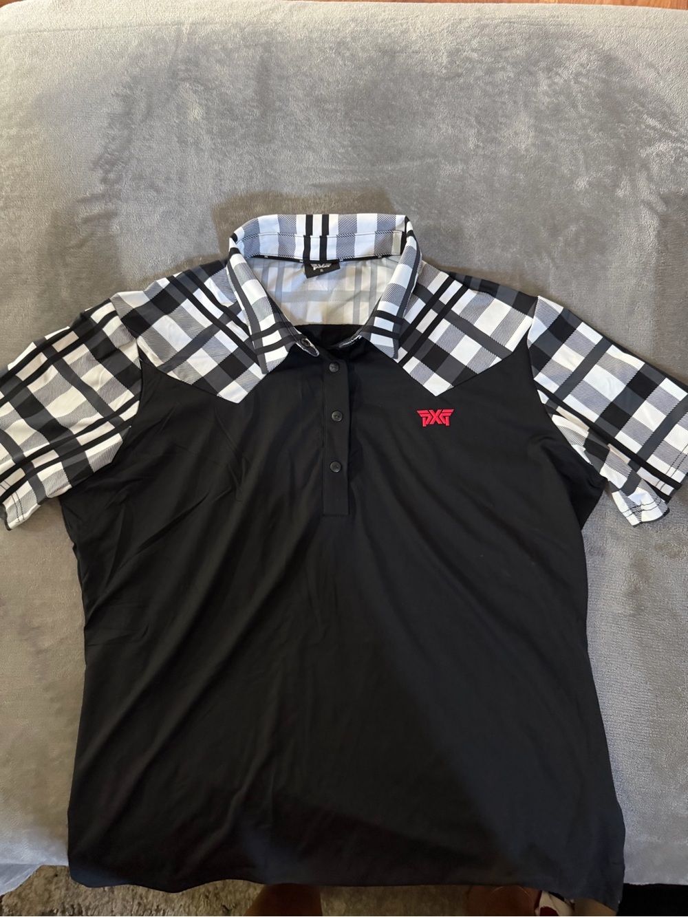 PXG Black Polo with Black & White Plaid Shoulders and Pink Logo